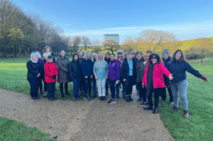 22 women walkers smiling at the camera in a Milton Keynes park