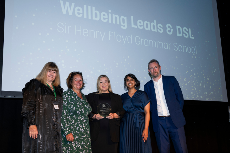 Leap Chair Sue Imbriano with 4representatives of Henry Floyd school in front of a screen saying Wellbeing Leads & DSL Sir Henry Floyd Grammar School