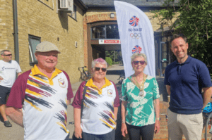 Ann & Jim from Bletchley St Martins Bowls Club standing alongside MK Mayor Marie and Leap's Chris Gregory in front of a Team GB pop up banner